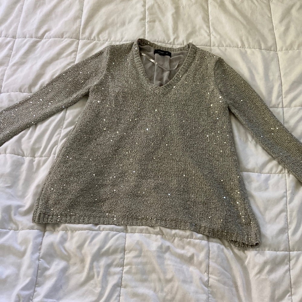 Grey top with sequins and detailed back.  Size small ATMOSPHERE.